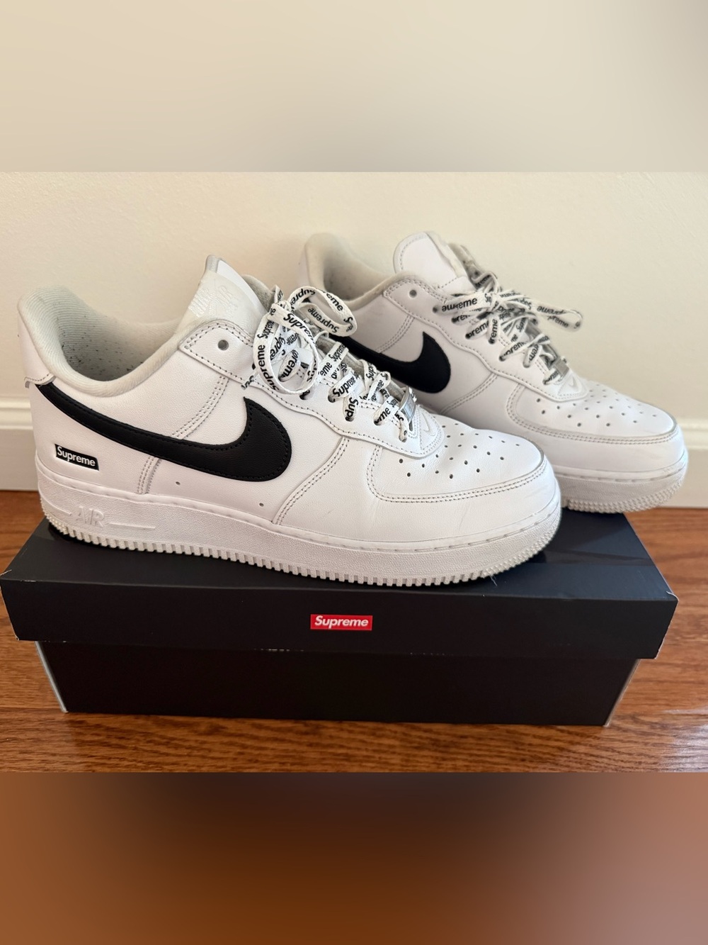 Nike White Leather Supreme Sneakers with Black Swoosh